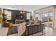 Bright living room with a decorative fireplace, stylish lighting and large sliding doors to the backyard at 7441 W Buckhorn Trl, Peoria, AZ 85383