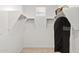 Bright walk-in closet with shelving and closet rods at 7441 W Buckhorn Trl, Peoria, AZ 85383