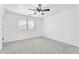 Bedroom with neutral walls, gray carpet, and a window at 7961 W Desert Blossom Way, Florence, AZ 85132