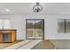 A kitchen area with a window, stainless steel dishwasher, and sliding glass doors at 7961 W Desert Blossom Way, Florence, AZ 85132