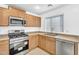 The spacious kitchen features stainless steel appliances and plenty of cabinet space at 7961 W Desert Blossom Way, Florence, AZ 85132