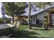 Spacious backyard with artificial turf, mature trees, dining and gazebo at 891 W Moon Shadow Dr, Casa Grande, AZ 85122