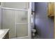 Bathroom featuring a shower with sliding doors and a gray accent wall at 891 W Moon Shadow Dr, Casa Grande, AZ 85122