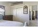 Bedroom with a view into the living room and closet with sliding doors at 891 W Moon Shadow Dr, Casa Grande, AZ 85122