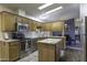 Well-maintained kitchen featuring stainless steel appliances, ample cabinetry, and an island at 891 W Moon Shadow Dr, Casa Grande, AZ 85122