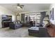 Cozy living room featuring a large sectional couch and natural light at 891 W Moon Shadow Dr, Casa Grande, AZ 85122
