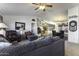 Open-concept living room flowing into a dining area and kitchen at 891 W Moon Shadow Dr, Casa Grande, AZ 85122