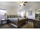 Spacious main bedroom boasts a large bed, bedside tables, an ensuite bathroom, and a walk-in closet at 891 W Moon Shadow Dr, Casa Grande, AZ 85122
