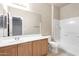 Bathroom featuring wood cabinetry, white countertops and a shower/tub combo at 900 S 94Th St # 1203, Chandler, AZ 85224