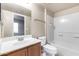 Bright bathroom featuring a single sink vanity, a mirror and tiled shower and tub combo at 900 S 94Th St # 1203, Chandler, AZ 85224