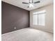 Cozy bedroom with neutral carpet, accent wall, and a large window at 900 S 94Th St # 1203, Chandler, AZ 85224