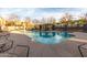 Community pool with a variety of lounge chairs for residents to relax at 900 S 94Th St # 1203, Chandler, AZ 85224
