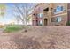 Multi-story condo building featuring colorful facades, private balconies, and desert landscaping at 900 S 94Th St # 1203, Chandler, AZ 85224