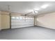 A clean, organized garage with epoxy flooring, a white garage door, and ample space at 900 S 94Th St # 1203, Chandler, AZ 85224