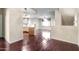 Open-concept living room and kitchen featuring hardwood floors and an open floor plan at 900 S 94Th St # 1203, Chandler, AZ 85224
