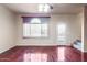Bright living room featuring hardwood floors, a large window, and a view of the outside at 900 S 94Th St # 1203, Chandler, AZ 85224