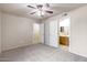 Spacious main bedroom with a ceiling fan, neutral colors and an ensuite bathroom at 900 S 94Th St # 1203, Chandler, AZ 85224