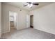 Large main bedroom featuring a ceiling fan, soft carpet and direct access to a walk-in closet at 900 S 94Th St # 1203, Chandler, AZ 85224