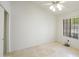 Neutral bedroom featuring a ceiling fan and a window with blinds at 9445 S La Rosa Dr, Tempe, AZ 85284