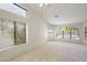 Bright bedroom with high ceilings, large windows and neutral carpeting at 9445 S La Rosa Dr, Tempe, AZ 85284