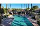 Resort-style community pool with ample lounge seating and shaded areas for relaxation at 9445 S La Rosa Dr, Tempe, AZ 85284
