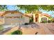Charming single-story home featuring a well-maintained front yard and a classic tile roof at 9445 S La Rosa Dr, Tempe, AZ 85284