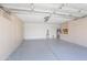 Spacious garage with built-in cabinets and epoxy flooring at 9445 S La Rosa Dr, Tempe, AZ 85284