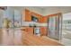Close up of a kitchen showcasing stainless steel appliances, wooden cabinets, and tile flooring at 9445 S La Rosa Dr, Tempe, AZ 85284