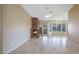 Spacious living room boasting a brick fireplace, tile floors, and a ceiling fan at 9445 S La Rosa Dr, Tempe, AZ 85284