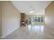 Comfortable living room offering tile floors, a charming fireplace, and access to an outdoor patio at 9445 S La Rosa Dr, Tempe, AZ 85284