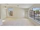 Open living space with vaulted ceilings and large windows offering plenty of natural light at 9445 S La Rosa Dr, Tempe, AZ 85284
