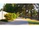 Scenic walkway lined with mature trees and landscaping at 9445 S La Rosa Dr, Tempe, AZ 85284