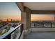 Balcony overlooking the city at sunset, surrounded by glass railing at 1040 E Osborn Rd # 1004, Phoenix, AZ 85014