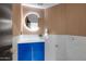 Modern bathroom with a blue vanity, designer fixtures, and a lighted mirror at 1040 E Osborn Rd # 1004, Phoenix, AZ 85014