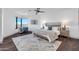 The main bedroom boasts a large rug, hardwood floors, and gorgeous city views from the corner window at 1040 E Osborn Rd # 1004, Phoenix, AZ 85014