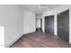 A bedroom showing hardwood floors and black closets at 1040 E Osborn Rd # 1004, Phoenix, AZ 85014