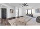 Spacious bedroom with a comfortable chair and a large window overlooking the city skyline at 1040 E Osborn Rd # 1004, Phoenix, AZ 85014