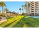 Lush green lawn with shaded pavilion that features lounge seating near the pool at 1040 E Osborn Rd # 1004, Phoenix, AZ 85014