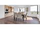 Inviting dining space featuring hardwood floors, city views, built-in cabinetry and a modern table for six at 1040 E Osborn Rd # 1004, Phoenix, AZ 85014