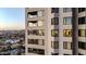 Modern high-rise exterior with balconies offering views of the city skyline and surrounding neighborhood at 1040 E Osborn Rd # 1004, Phoenix, AZ 85014