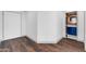 Hallway with a view to a bathroom that has a blue vanity and lighted mirror at 1040 E Osborn Rd # 1004, Phoenix, AZ 85014