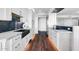 Modern kitchen with white cabinets, marble countertops, and black fixtures at 1040 E Osborn Rd # 1004, Phoenix, AZ 85014