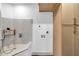 Clean laundry room featuring a dog washing station, modern cabinets, and a sleek, white interior at 1040 E Osborn Rd # 1004, Phoenix, AZ 85014