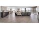 Spacious living area boasts hardwood floors, modern furniture, city views, and an open concept design at 1040 E Osborn Rd # 1004, Phoenix, AZ 85014