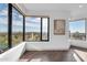 Bright, airy room with floor-to-ceiling windows offering great city views, hardwood floors, and natural light at 1040 E Osborn Rd # 1004, Phoenix, AZ 85014