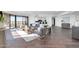 Inviting living room featuring hardwood floors, contemporary decor, comfortable seating, and access to a modern kitchen at 1040 E Osborn Rd # 1004, Phoenix, AZ 85014