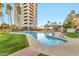 Community pool featuring a nearby hot tub and high rise in the background at 1040 E Osborn Rd # 1004, Phoenix, AZ 85014