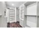 A bright walk-in closet with recessed lighting, storage shelves, and plenty of hanging space at 1040 E Osborn Rd # 1004, Phoenix, AZ 85014
