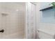 Bathroom featuring shower/tub combo with tile surround, toilet and accent shelf with decor at 1051 S Dobson Rd # 137, Mesa, AZ 85202
