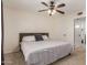 Neutral bedroom featuring a ceiling fan and a connecting door to the bathroom at 1051 S Dobson Rd # 137, Mesa, AZ 85202